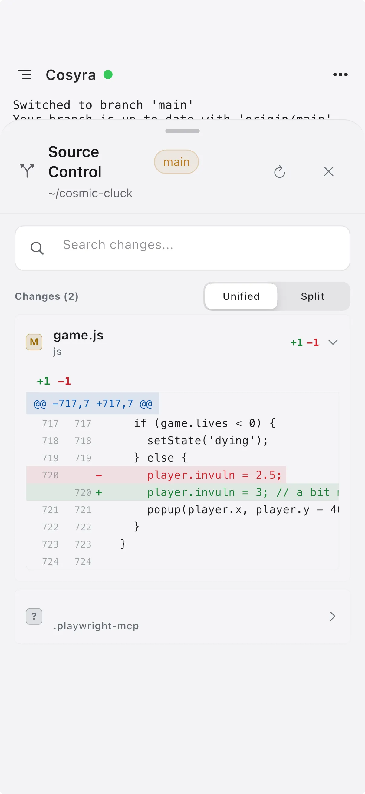 The Cosyra source-control view showing a unified diff of changed files