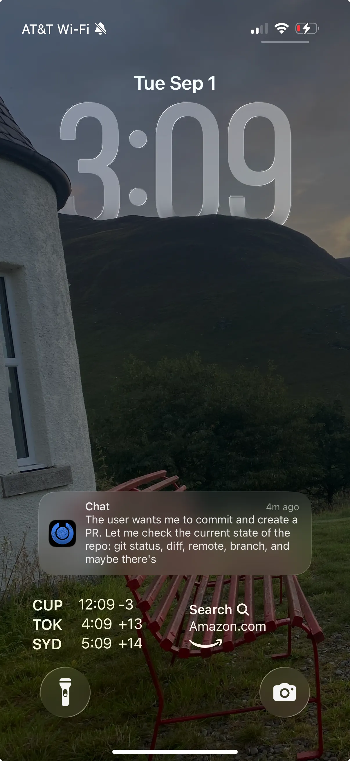 An iPhone lock screen showing a Cosyra push notification from an agent working on a pull request